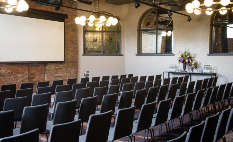 Seats and screen set up in event space at Avon Gorge by Hotel du Vin
